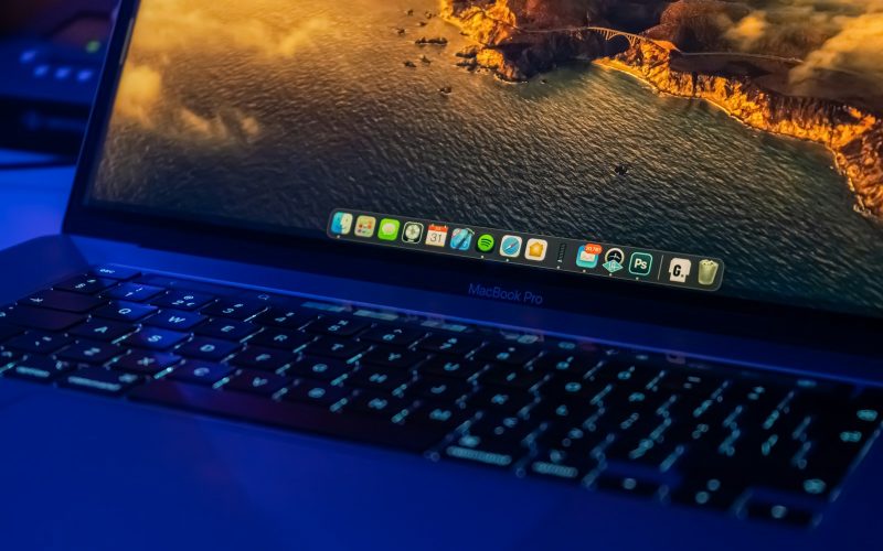 black laptop computer turned on displaying desktop icons